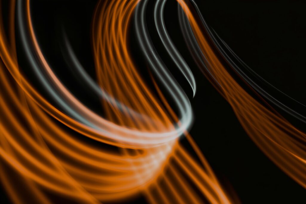 A wavy orange black and white branded background